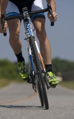 person-riding-road-bike-on-the-road-38296